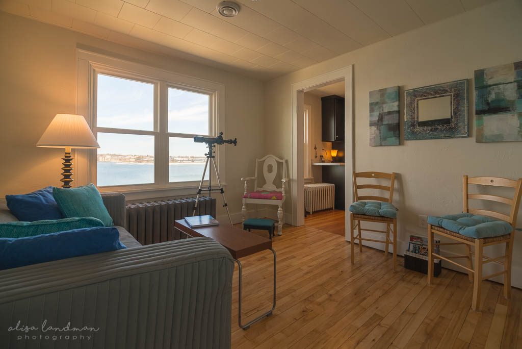 Living Room with telescope at Eagle’s Nest, Waterfront Suite in Door County